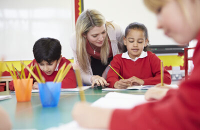 Teacher and primary students