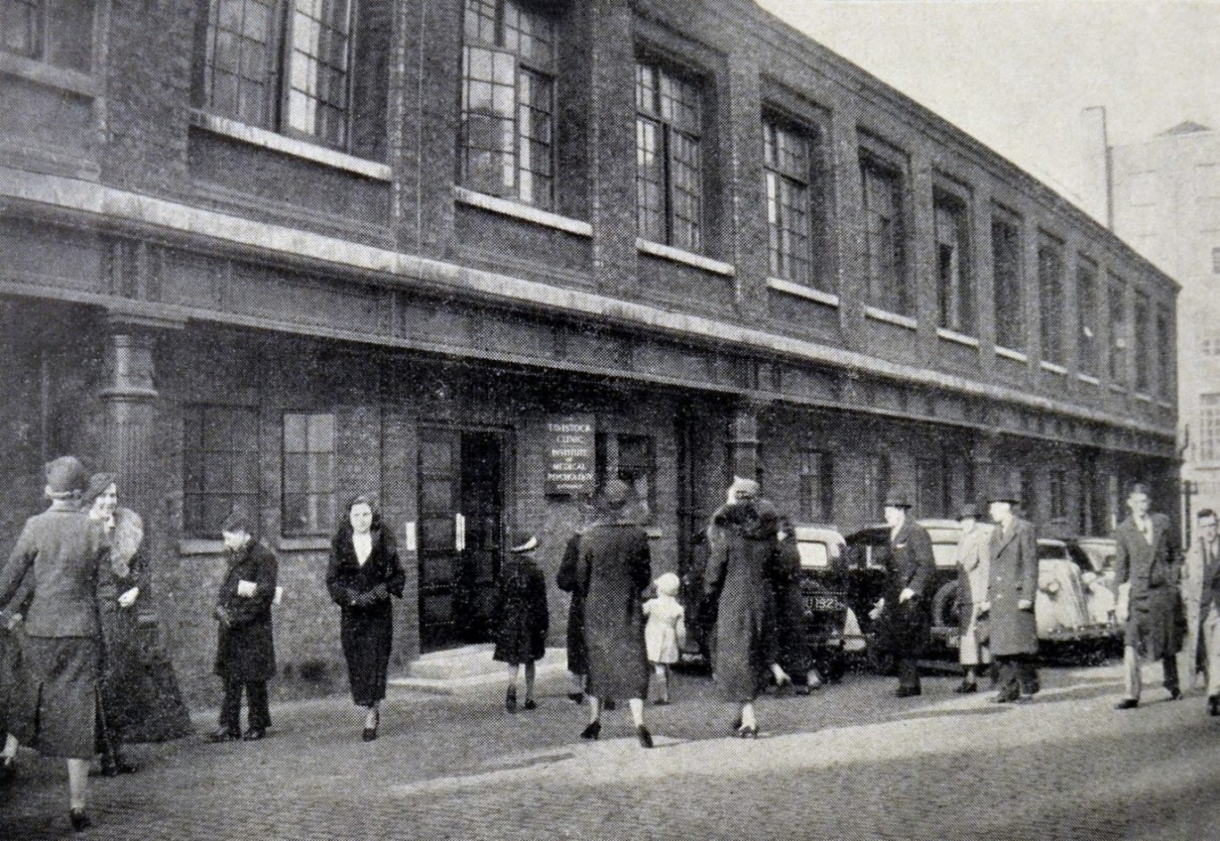 Black and white image of a  brick building