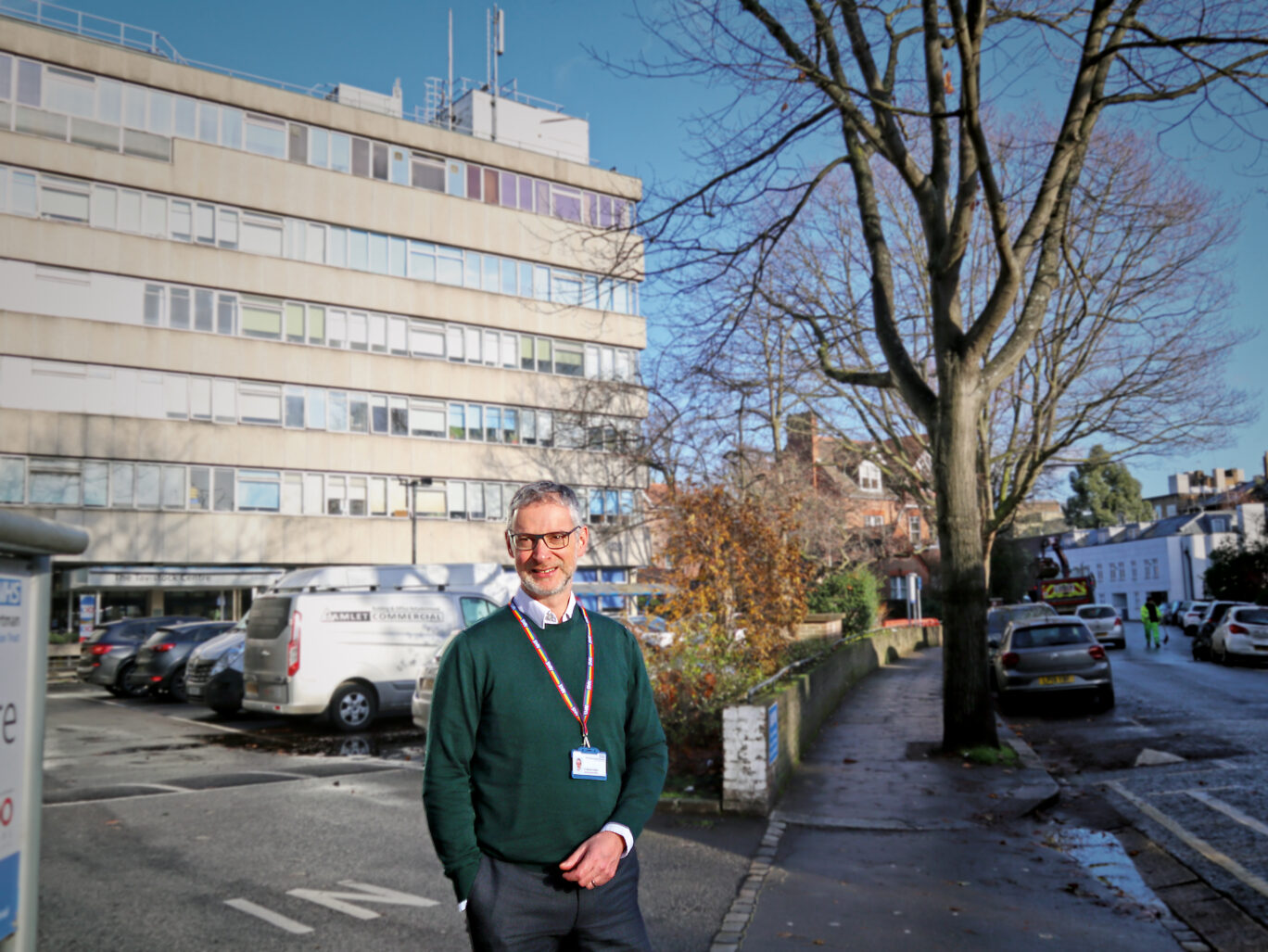 Photograph of Michaël Holland a man with short grey hair outside the Tavistock Centre