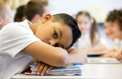 An image of a pupil who looks distant and upset.