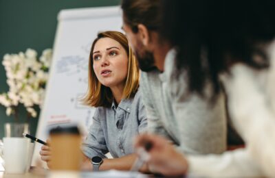 Consultant sharing ideas in a meeting