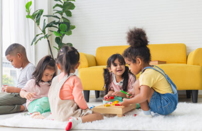 Children playing with toys in living room