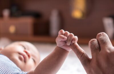 New born baby Catch my little finger stock photo
