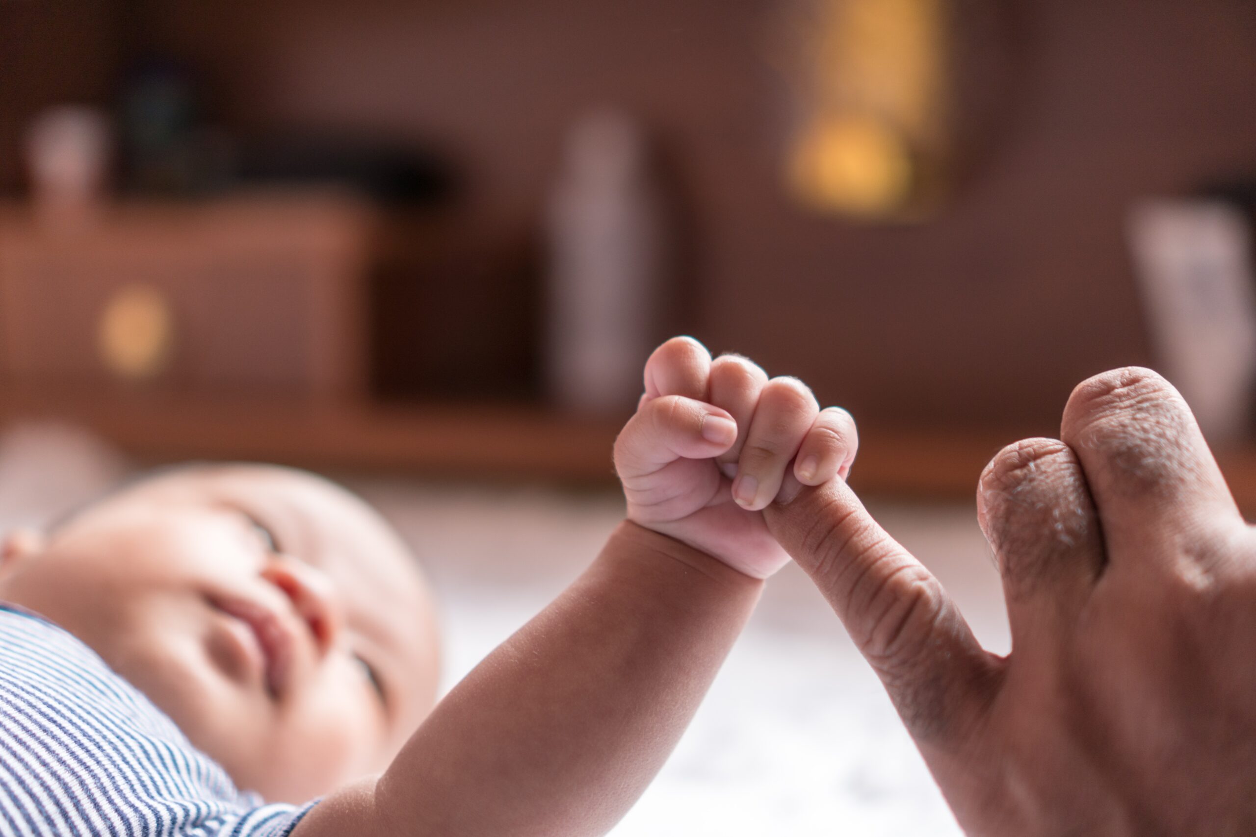 New born baby Catch my little finger stock photo