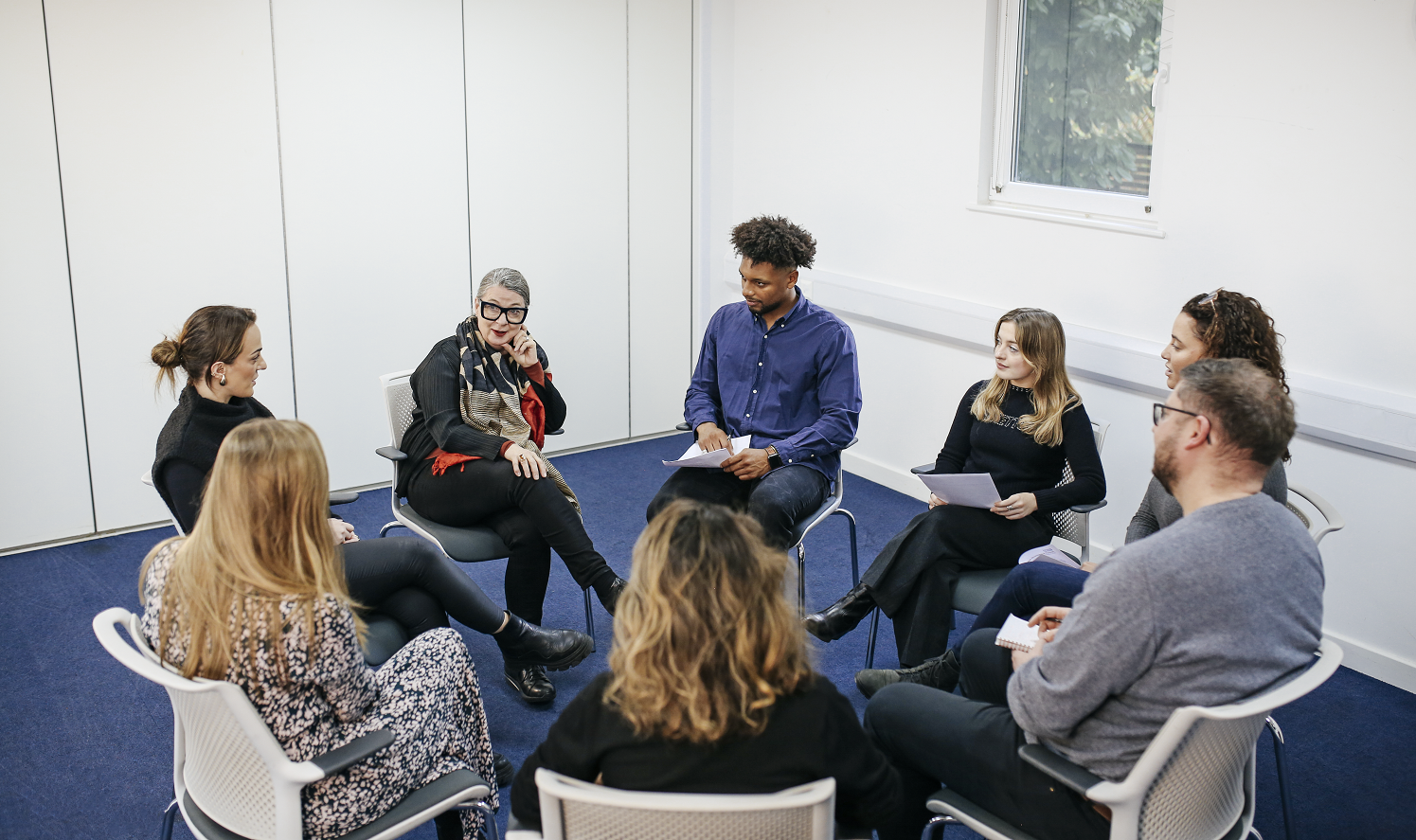 Group of students learning in a circle
