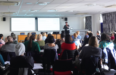 Doctoral conference presentation in lecture theatre