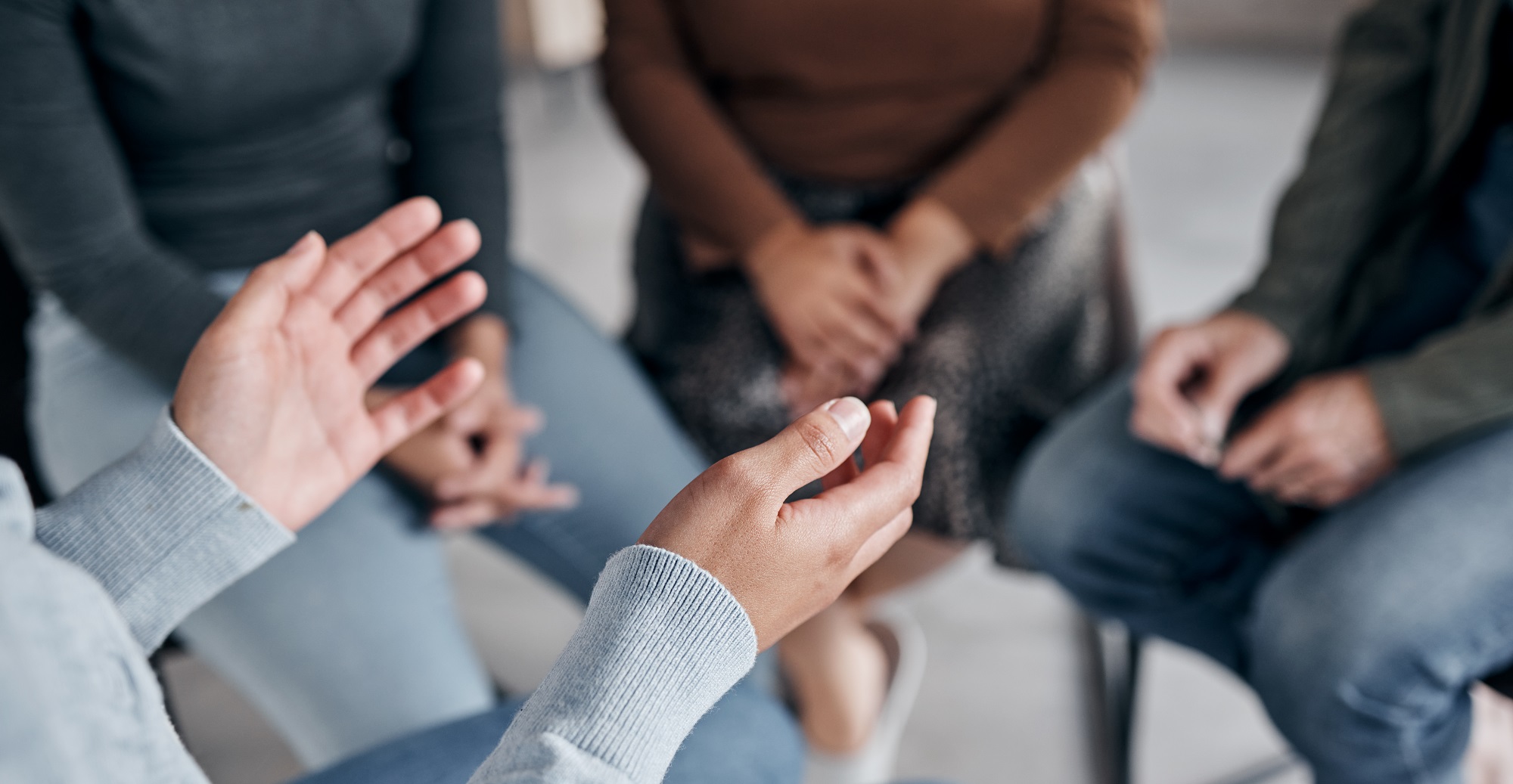 Close-up of hands during workshop discussion