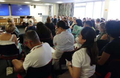 Audience Watching Presenter at Doing Difference Differently Seminar