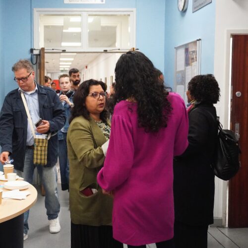 Small group of people talking during open day