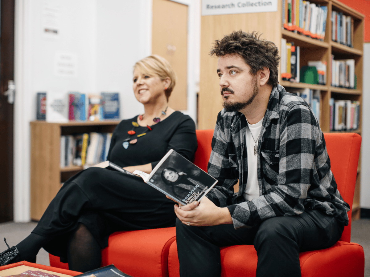 Student and tutor in library