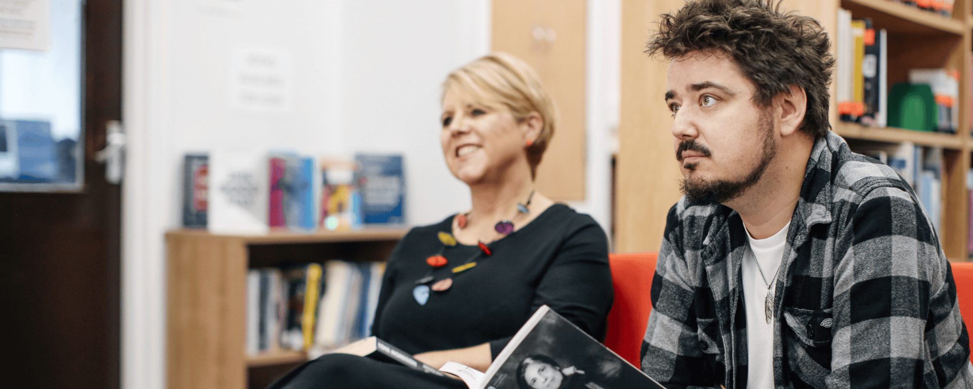 Student and tutor in library