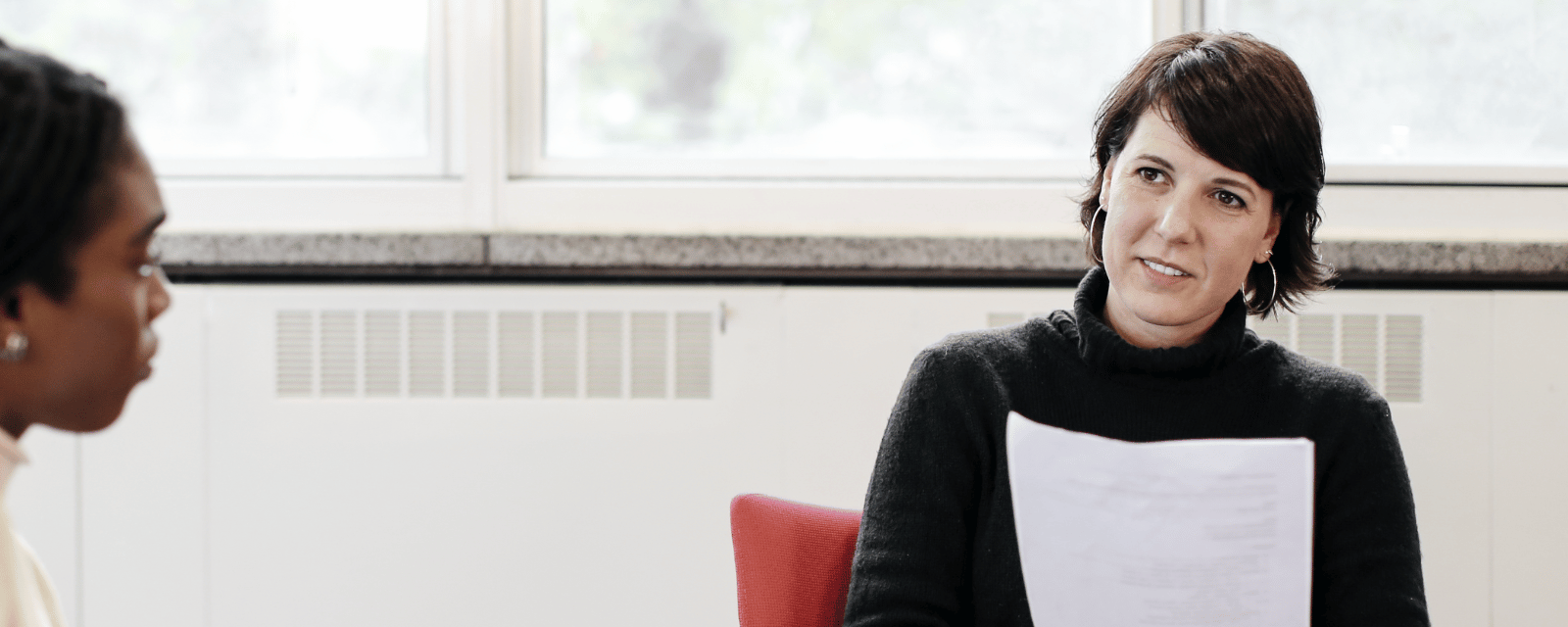 Tutor smiling at students