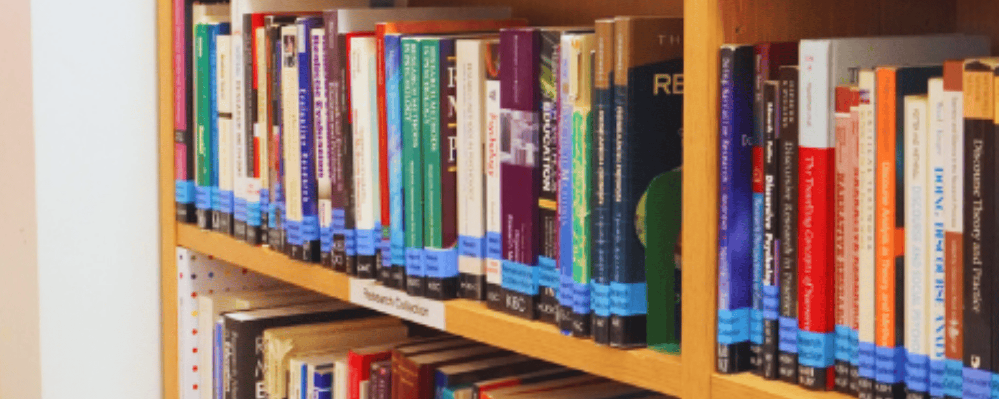 Bookshelf with research textbooks