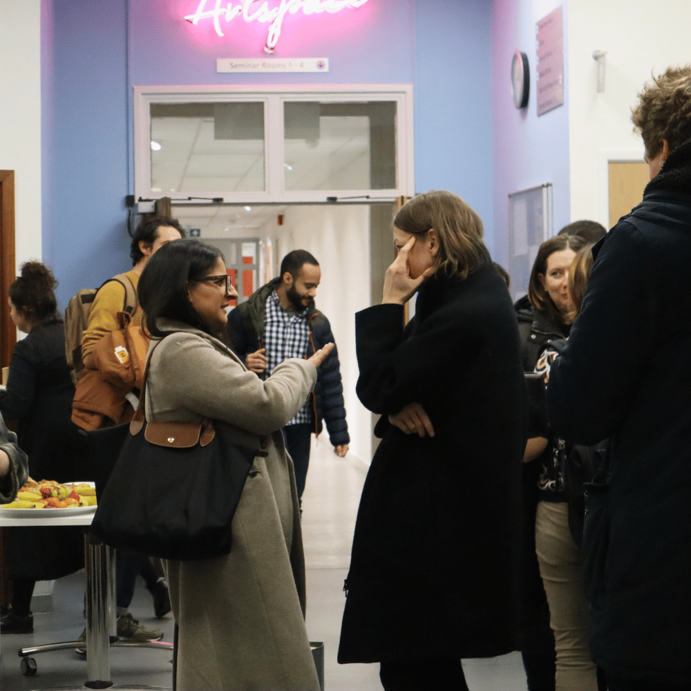 Visitors chatting in corridor