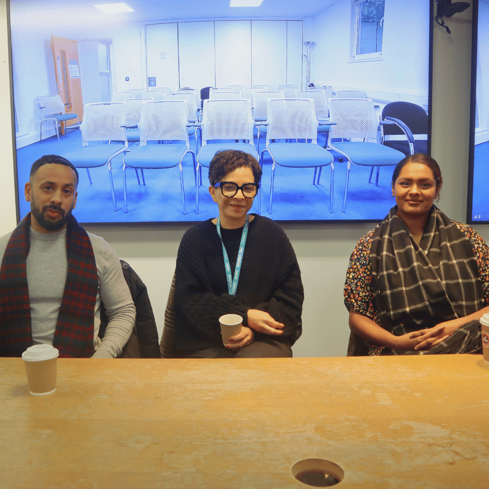 Three students from our student panel sat down and smiling